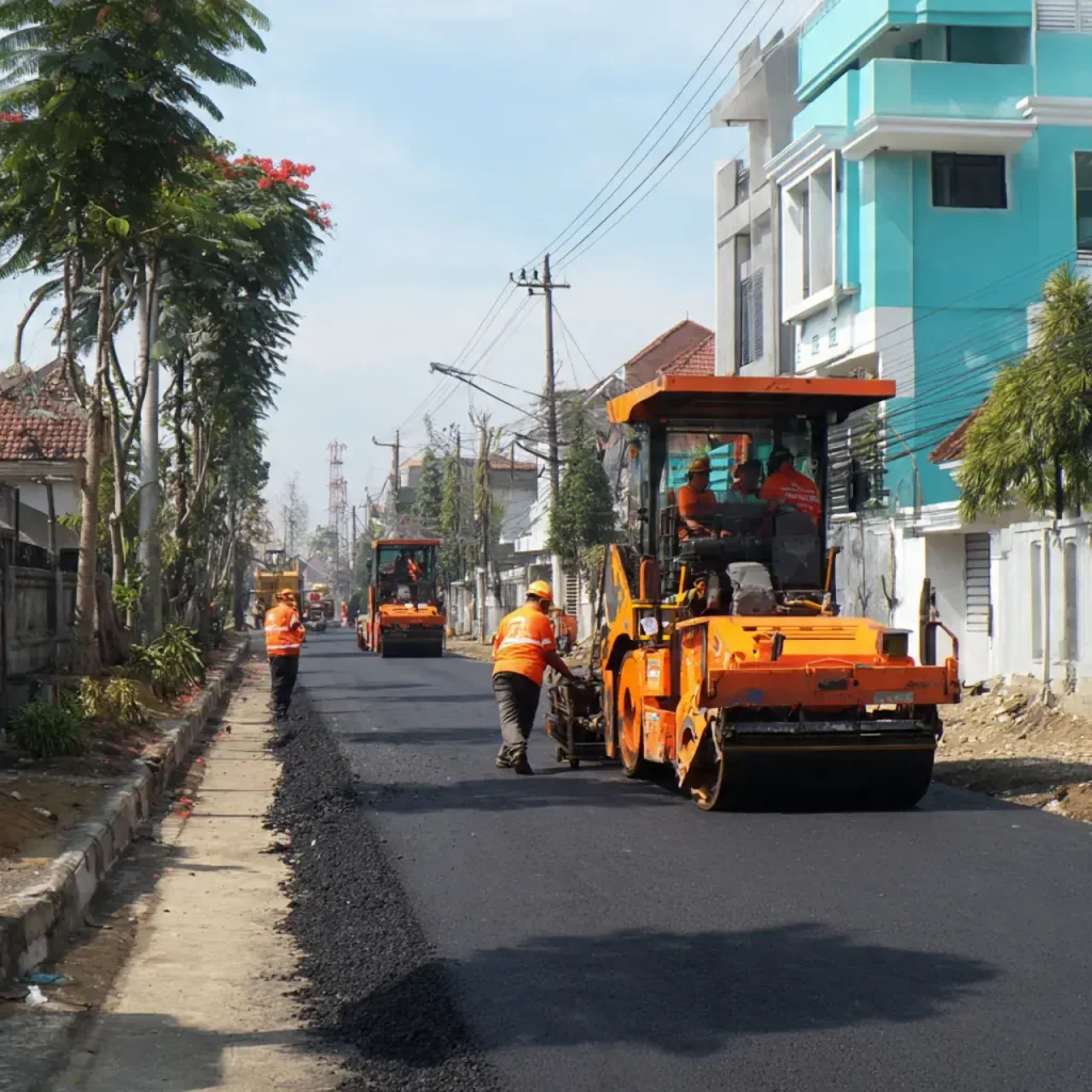 Proses Pemadatan Aspal Hotmix di Pancoran Mas